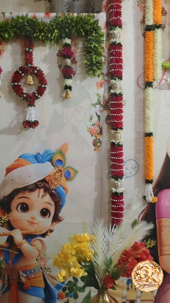 Floral arrangements beside backdrop