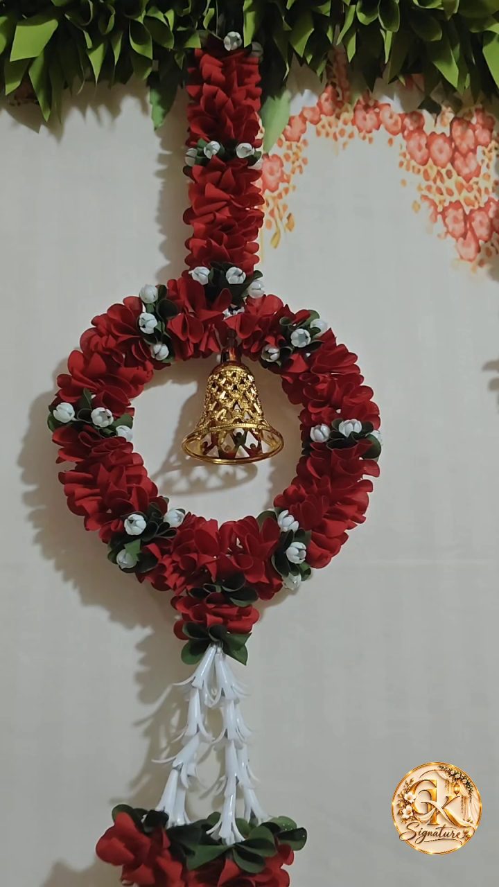 Red floral wreath with bell